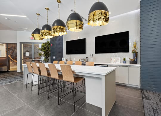 a room with a long table and chairs