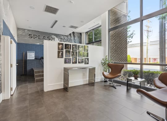 an office with a large window and a desk with a chair