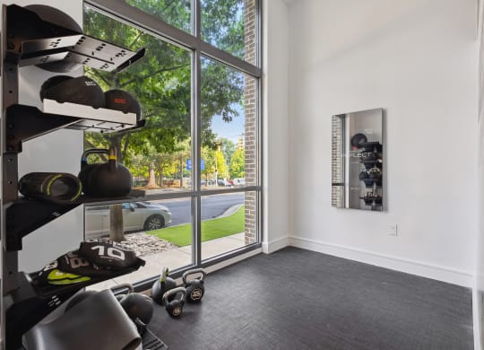 a room with a large window and white walls