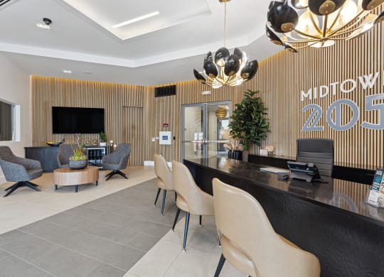 a lobby with a reception desk and chairs