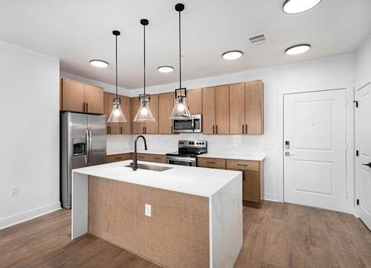 A kitchen with wooden cabinets and a white countertop.