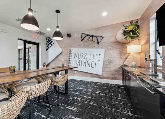 A modern office space with a sign that reads "Work Life Balance".