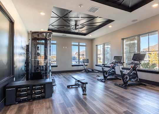 A spacious home gym with a variety of exercise equipment.