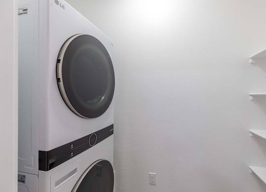 A white LG washing machine in a laundry room.