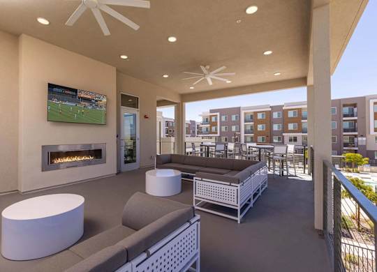 A modern living room with a fireplace and a television.