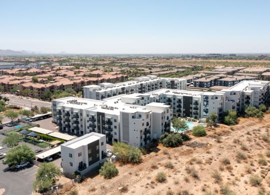 an aerial view of slate scottsdale large apartment complex in the middle of a desert