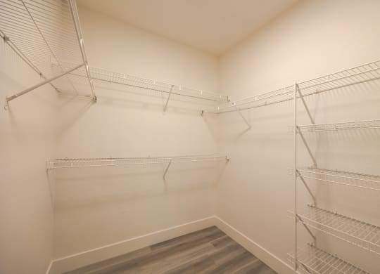 a spacious walk in closet at the whispering winds apartments in pearland, tx