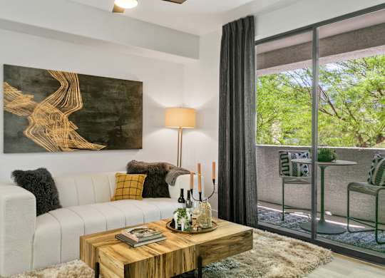 a living room with a white couch and a coffee table
