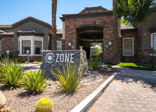 a home with a zone sign in front of it