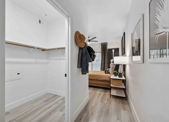 a bedroom with a bed and a ceiling fan