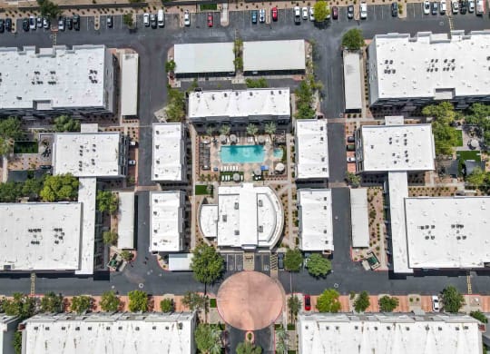 arial view of buildings with a pool in the middle