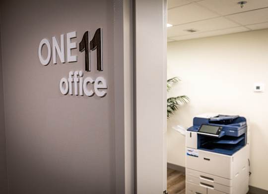 a one 11 office door with a one11 office sign on it