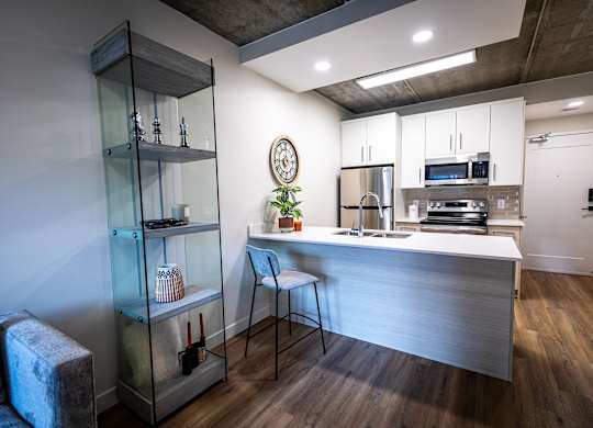 a kitchen with a counter top and a refrigerator