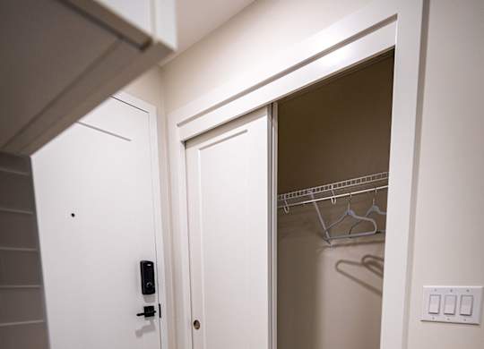 a small bathroom with a closet and a shower