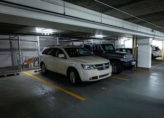 a parking garage with cars parked in it
