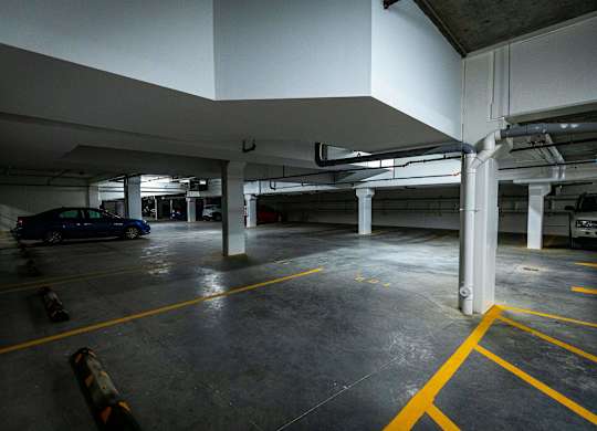 a parking garage with a car in it