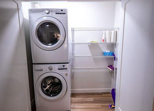 a small laundry room with a washing machine in it