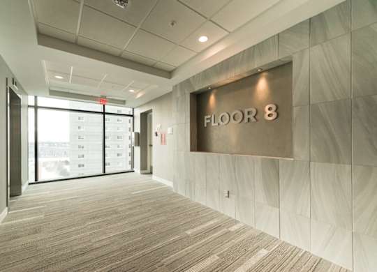 A hallway with a sign that says
