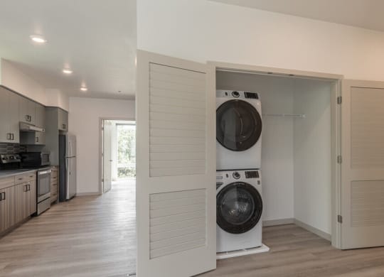 a washer and dryer in a room with a kitchen