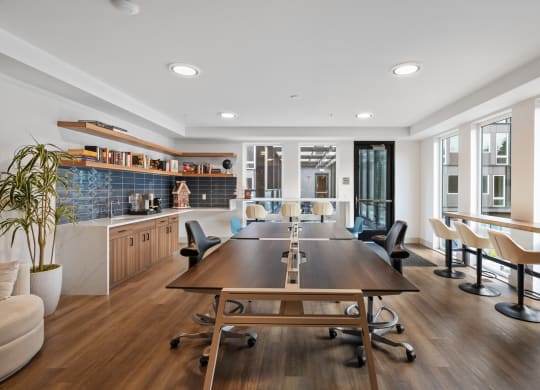 a conference room with a long wooden table and chairs