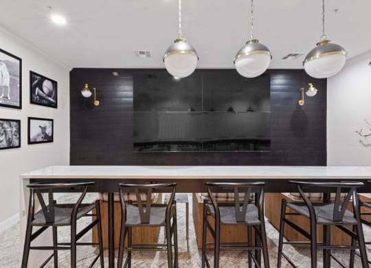 a dining room with a long table and chairs and a fireplace in the background  at Harper's Crossing, Langhorne