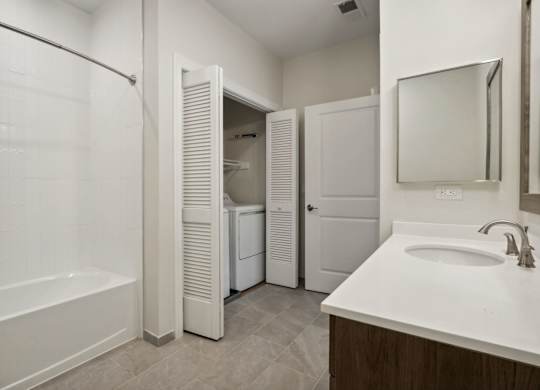 Spacious Bathroom with tub, sink and mirror at Heritage Court, Ewing, NJ