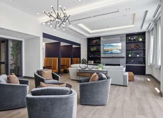 Lounge area with comfortable seating at Heritage Court, New Jersey, 08628