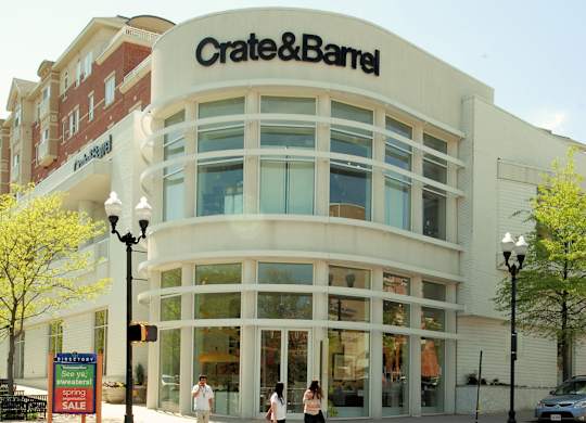 A Crate & Barrel store with two people standing in front.