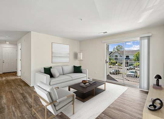 A living room with a white couch and a wooden coffee table.