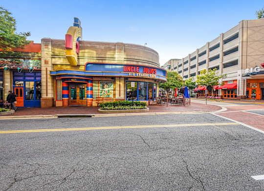 A street view of a city with a building that has a sign that says
