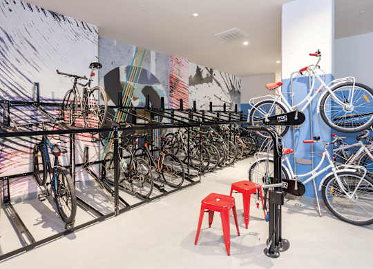 A bicycle rack with many bikes on it.