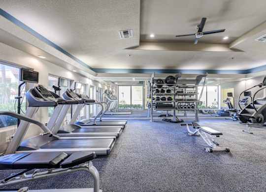 Tresa at Arrowhead Apartments Fitness Center with Treadmills and Weight Racks