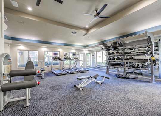 Tresa at Arrowhead Apartments Fitness Center with Treadmills and Weight Racks