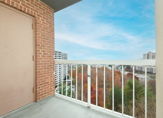 the view from the balcony of an apartment building with a door and a balcony railing  at Cascade at Landmark, Alexandria, VA