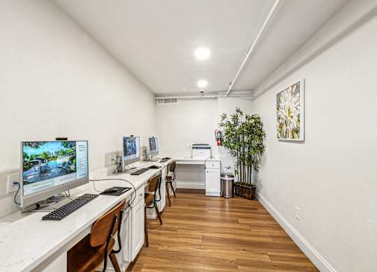 A room with a white desk and a computer monitor.