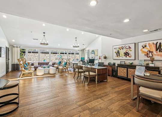A well-lit room with wooden floors and furniture.