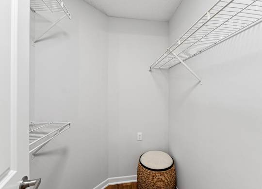 A white closet with a shelf and a basketat Elme Druid Hills, Atlanta, Georgia