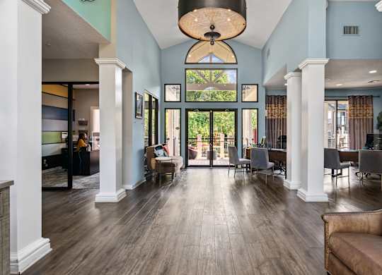 A large room with a couch and a table.
