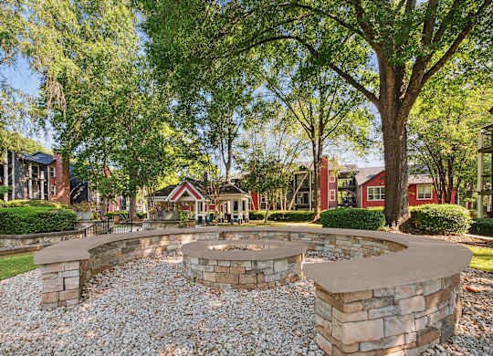A stone wall with a circular opening in the middle.