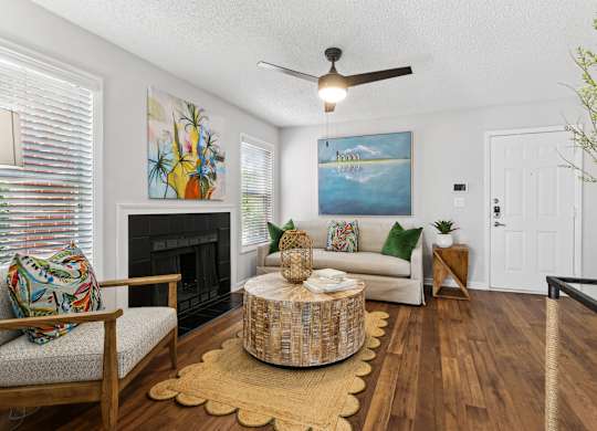 A living room with a fireplace and a painting on the wallat Elme Druid Hills, Atlanta, Georgia