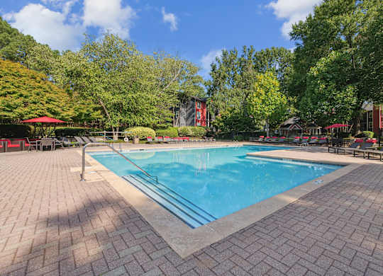 A rectangular pool surrounded by a brick patio at Elme Druid Hills, Atlanta, Georgia