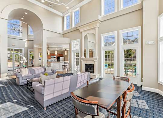 A large room with a dining table and chairs at Elme Dulles, Herndon, VA