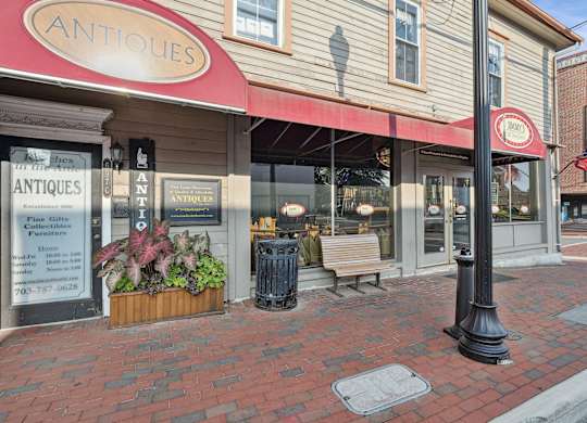 A storefront with a red awning