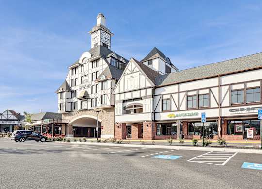 A large building with a clock tower is the focal point of the image.