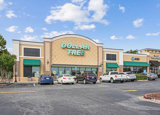 A Dollar Tree store is shown with cars parked in front.