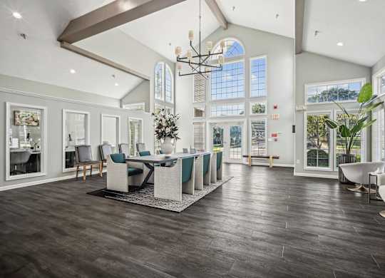 A large, well-lit room with a dining table and chairs.
