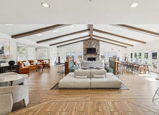 A spacious living room with a fireplace and a large couch at Elme Manassas, Manassas, 20109