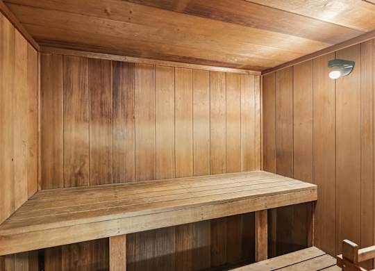 A wooden bench in a wooden room.