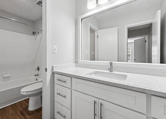 A white bathroom at Elme Sandy Springs Apartments, Atlanta, GA, 30350