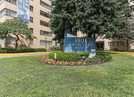 A sign for Connecticut Avenue is in front of a building.